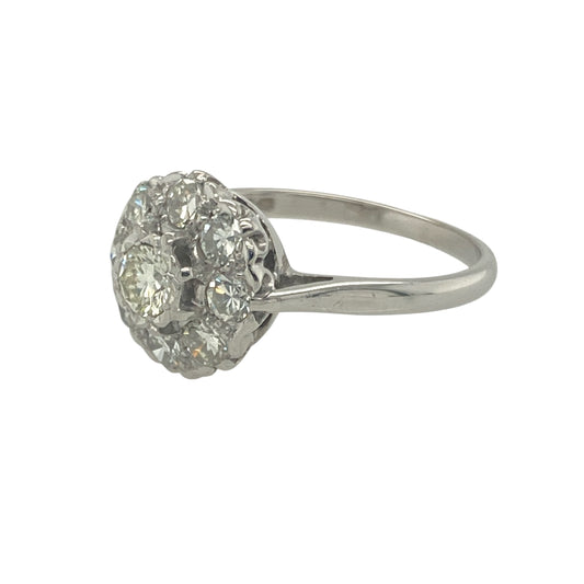 Bring vintage charm and brilliant sparkle to your collection with this pre-owned 18ct white gold and diamond set cluster ring, offering timeless elegance and refined detail — perfect for special occasions or classic everyday luxury.
Design: This vintage-style cluster ring features a central diamond of approximately 0.17ct, surrounded by a halo of additional diamonds totalling approximately 0.24ct, for a combined diamond content of around 0.41ct.