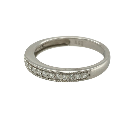 Bring delicate sparkle and refined detail to your collection with this pre-owned 9ct white gold diamond band ring—perfect for everyday elegance or pairing with other rings for a layered look.
Design: The ring features a 2mm wide front accented with diamonds and finished with a beaded edge for added texture and charm.
Material: Made from 9-carat white gold, the cool-toned polished finish enhances the brilliance of the diamonds.