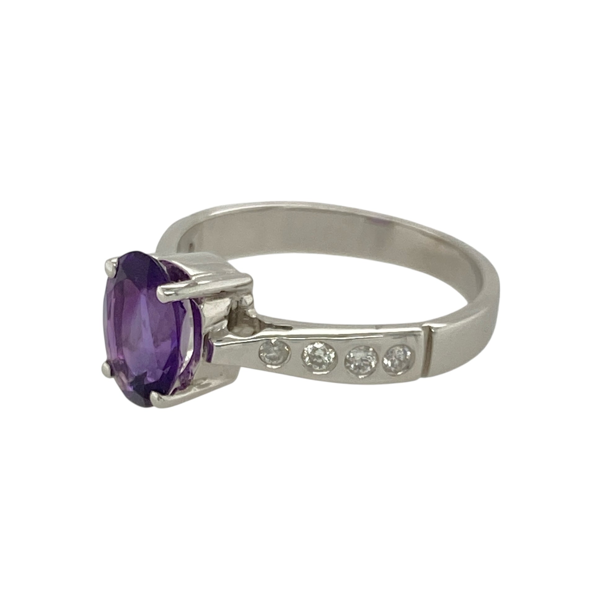 Bring vibrant colour and refined sparkle to your collection with this pre-owned 18ct white gold diamond and amethyst ring—perfect for adding elegance to both everyday wear and special occasions.
Design: The ring features an 8mm by 6mm oval amethyst at the centre, complemented by diamonds set along the shoulders for added brilliance.
Material: Made from 18-carat white gold, the polished finish enhances the rich purple hue of the amethyst and the sparkle of the diamonds.