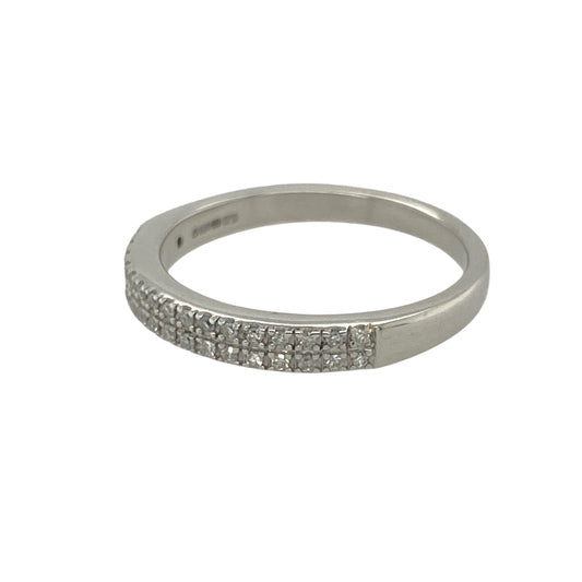Bring refined sparkle and modern elegance to your collection with this pre-owned 9ct white gold two row diamond band ring—a timeless design with subtle brilliance.
Design: The ring features a 2.5mm wide band with two rows of diamonds along the front, totalling approximately 0.10ct of diamond content for delicate sparkle.
Material: Made from 9-carat white gold, the polished finish enhances the contemporary style and complements the shimmer of the diamonds.