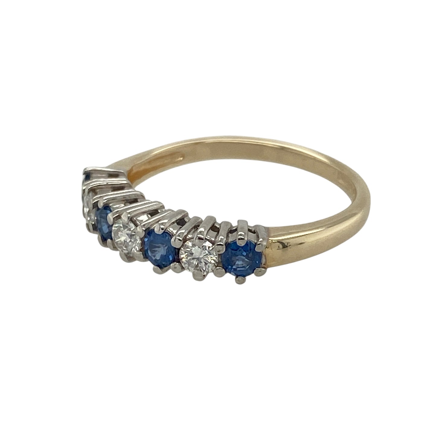 Bring classic elegance and vibrant colour to your collection with this pre-owned 9ct yellow gold sapphire and diamond band ring, offering timeless style with a touch of sparkle—perfect for everyday wear or special occasions.
Design: The ring features round sapphires measuring 3mm in diameter, spaced with diamonds for a balanced and refined look.
Material: Made from 9-carat yellow gold, the polished finish provides a warm contrast to the deep blue sapphires and sparkling diamonds.