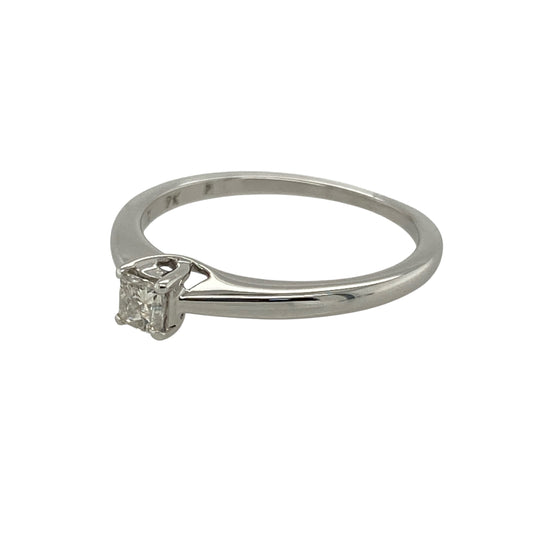 Celebrate timeless simplicity with this pre-owned 9ct white gold diamond solitaire ring, featuring classic elegance and understated sparkle—perfect for everyday wear or marking life’s special moments.
Design: The ring showcases a princess cut diamond of approximately 0.18ct, offering clean lines and brilliance that enhance its modern yet timeless appeal.
Material: Made from 9-carat white gold, the polished finish provides a bright and elegant backdrop for the diamond’s natural sparkle.