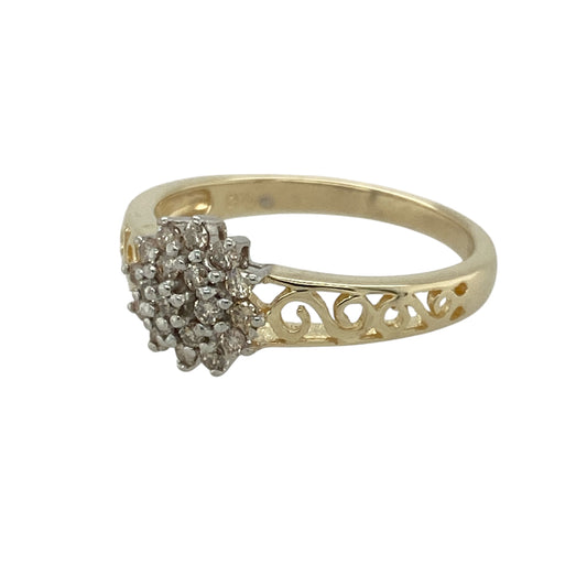 Add sparkle and elegance to your collection with this pre-owned 9ct yellow gold diamond cluster ring, a refined design with delicate detailing—perfect for everyday wear or special occasions.
Design: The ring features a central cluster of diamonds, enhanced by open-pattern shoulders that add lightness and character to the design.
Material: Made from 9-carat yellow gold, the polished finish provides a warm backdrop that complements the brilliance of the diamonds.