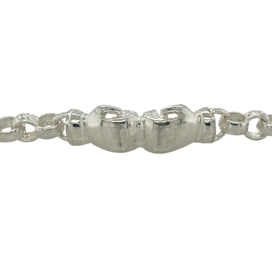 Add a fun and distinctive touch to a child’s collection with this new 925 solid silver boxing glove belcher bracelet, designed with alternating patterned and plain links for extra detail.
Design: The bracelet features striking boxing glove charms measuring 3cm by 1cm, adding a playful yet bold element to the design.
Material: Made from solid 925 sterling silver, the polished finish provides durability and lasting shine.
Bracelet Detail: Measuring 6.5 inches in length with 6mm wide links, and weighing 15.30