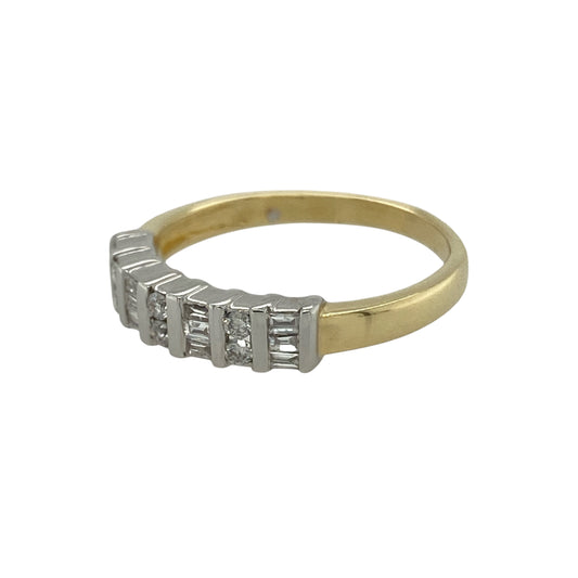 Bring refined sparkle and elegant design to your collection with this pre-owned 18ct yellow gold band ring, styled with a mix of brilliant and baguette-cut diamonds.
Design: The 4mm wide front of the band is set with alternating 0.20ct brilliant and baguette-cut diamonds, creating a sophisticated balance of sparkle and clean lines.
Material: Made from 18-carat yellow gold, the polished finish enhances the warm tone and provides a classic backdrop for the diamonds.