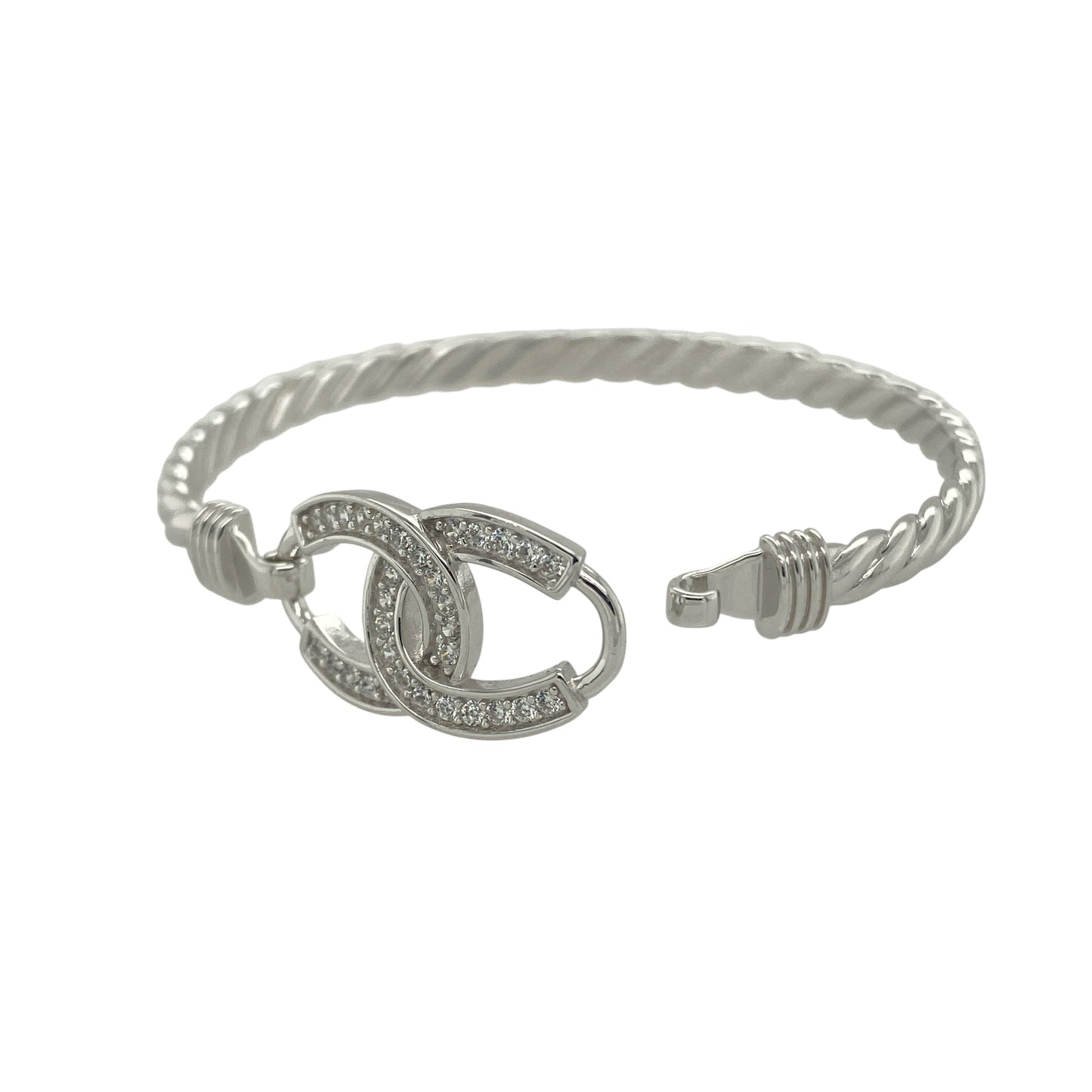 Bring sparkle and good fortune to your collection with this new 925 silver cubic zirconia children’s double horseshoe bangle, a charming design full of meaning and style.
Design: The bangle features a 12mm high front with two interlocking horseshoes, each accented with sparkling cubic zirconia stones for an elegant and eye-catching finish.
Material: Made from solid 925 sterling silver, the polished surface enhances the brilliance of the stones and gives the piece a bright, refined look.