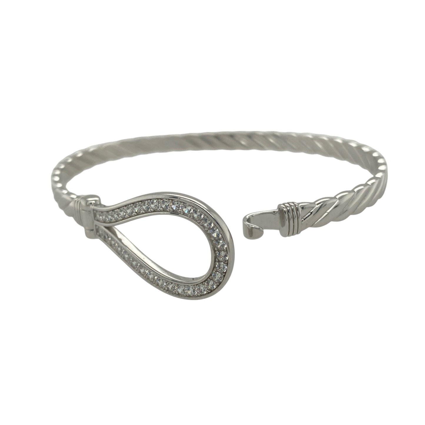 Bring timeless elegance and refined sparkle to your collection with this new 925 silver cubic zirconia horseshoe bangle, a graceful design symbolising luck and good fortune.
Design: The bangle features a 17mm high front with a classic horseshoe motif, beautifully accented with sparkling cubic zirconia stones for a bright and eye-catching finish.
Material: Made from solid 925 sterling silver, the polished surface enhances the shine and brilliance of the stones, giving the piece a sophisticated look.