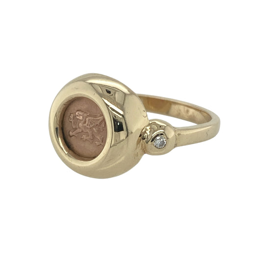 Bring bold character and Welsh heritage to your collection with this pre-owned 9ct yellow and rose gold diamond Clogau Welsh Dragon ring—a powerful design that embodies strength, pride, and elegance.
Design: The ring showcases the iconic Welsh Dragon in rich rose gold, set against a yellow gold background for a striking contrast. A sparkling diamond accent adds a touch of brilliance, enhancing the intricate detail and symbolic power of the design.