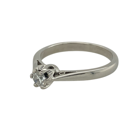 Bring classic sophistication and enduring elegance to your collection with this pre-owned platinum diamond solitaire ring—a timeless design that radiates understated luxury.
Design: The ring features a brilliant-cut diamond of approximately 0.21ct, securely held in a classic solitaire setting that allows maximum light to enhance the stone’s natural sparkle and brilliance.