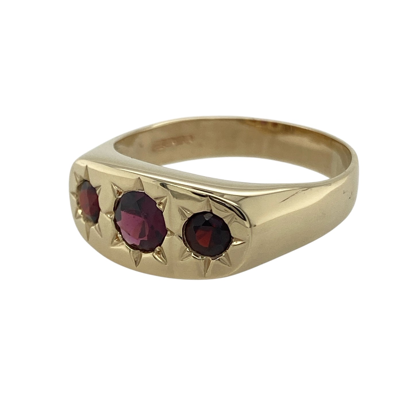 Bring rich colour and bold elegance to your collection with this pre-owned 9ct yellow gold garnet trilogy signet ring—a distinctive design combining classic form with deep, luxurious tones.
Design: The ring features a central round-cut garnet measuring 6mm in diameter, flanked by two smaller garnets in a refined trilogy arrangement that symbolises the past, present, and future. The deep red stones add warmth and sophistication to the bold signet style.