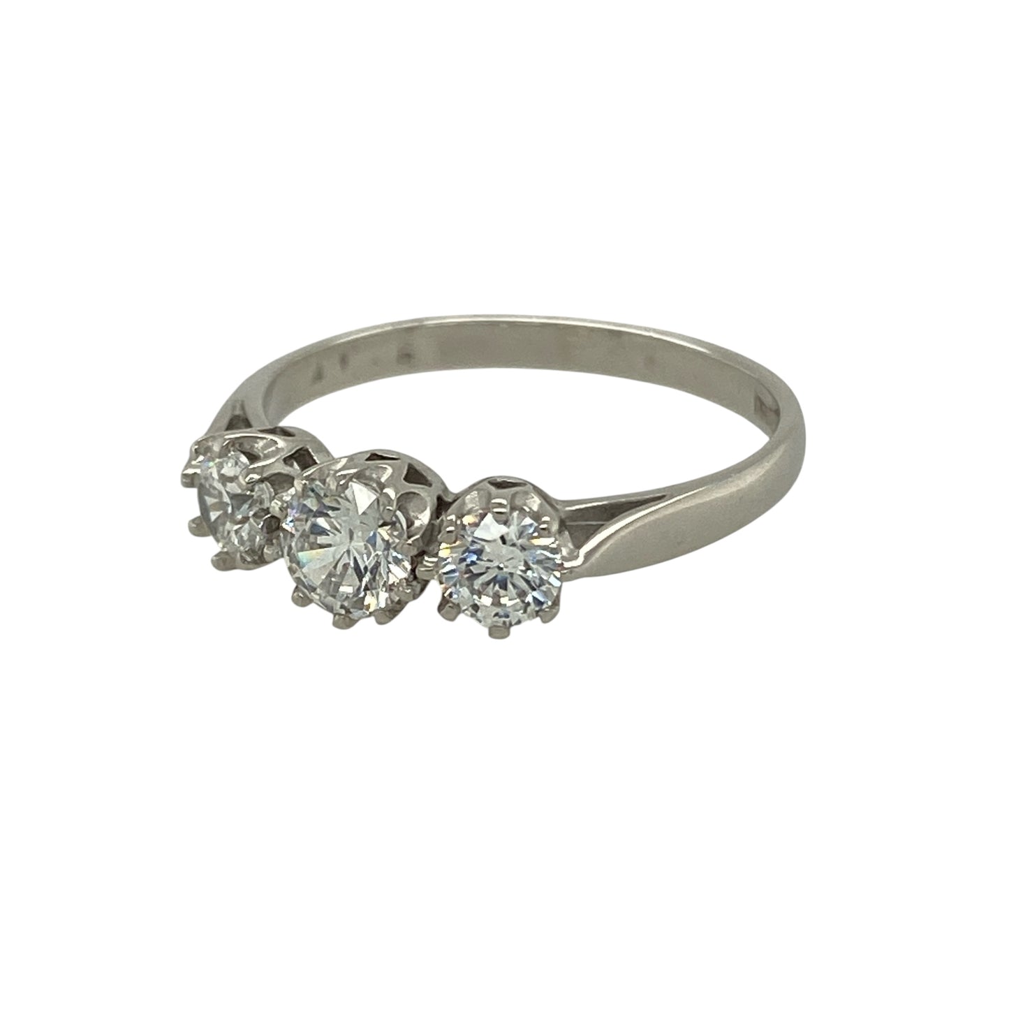 Bring brilliance and modern elegance to your collection with this pre-owned 9ct white gold cubic zirconia trilogy ring—a timeless design symbolising the past, present, and future.
Design: The ring features a 5mm round cubic zirconia at the centre, flanked by two 4mm stones on either side, creating a balanced and graceful trilogy arrangement. The sparkling stones capture and reflect the light beautifully for a radiant finish.