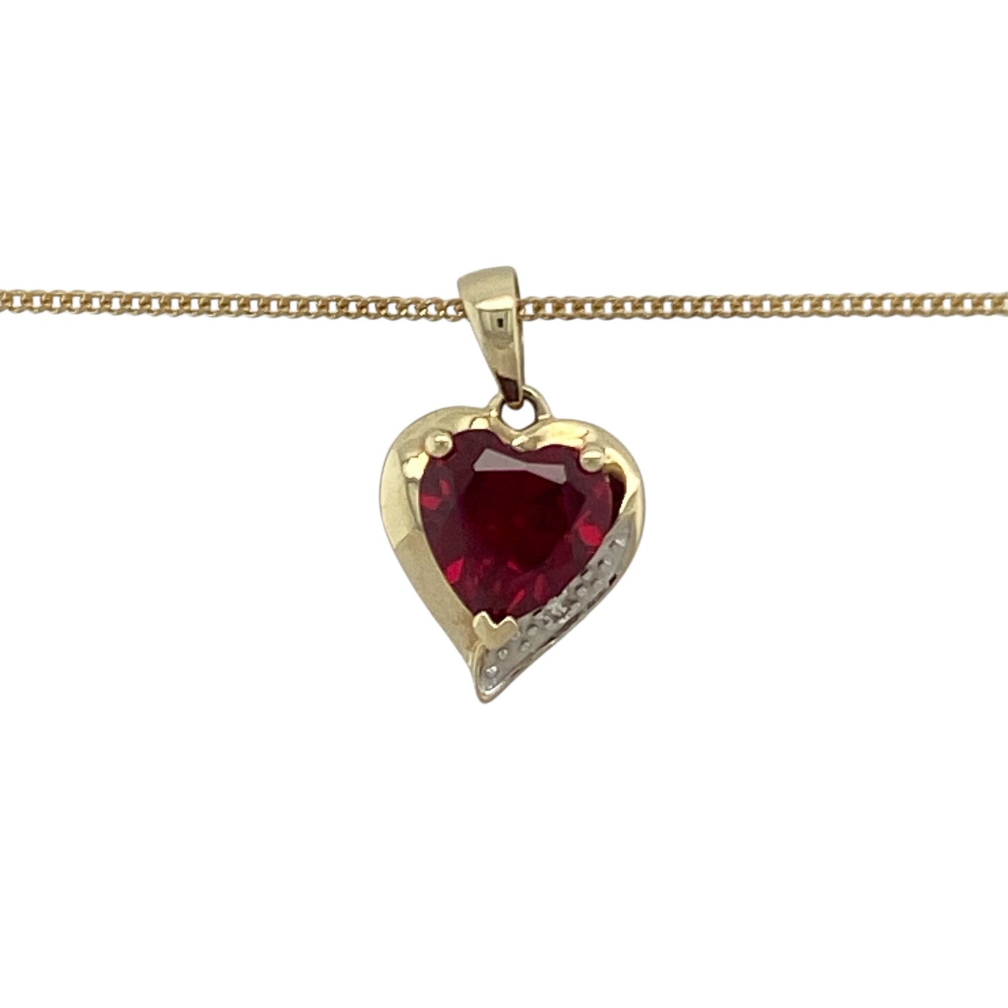 Bring romance, colour, and timeless elegance to your collection with this pre-owned 9ct yellow gold diamond and ruby heart pendant on an 18" curb chain necklace—a beautifully symbolic piece celebrating love and sophistication.
Design: The pendant features a striking 7mm heart-shaped ruby at its centre, radiating rich red tones that symbolise passion and devotion. Sparkling diamonds accent the design, adding brilliance and enhancing the beauty of the central gemstone.