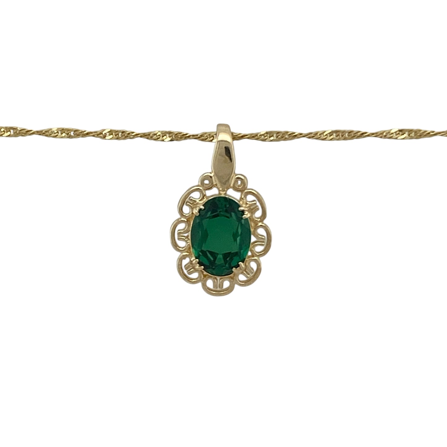 Bring vibrant colour and elegant simplicity to your collection with this pre-owned 9ct yellow gold and green stone pendant necklace, combining classic charm with refined sparkle—perfect for everyday wear or special occasions.
Design: The pendant features an oval emerald-coloured green stone measuring 8mm by 6mm, set in a timeless design and suspended from a 16-inch Singapore chain. The pendant, including the bail, measures 1.7cm in length, creating a delicate and balanced look.