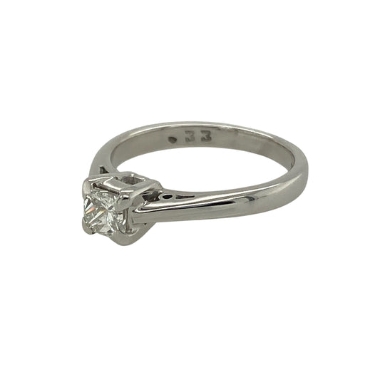 Bring modern elegance and timeless brilliance to your collection with this pre-owned 18ct white gold princess cut diamond solitaire ring, combining refined simplicity with radiant sparkle—perfect for engagements, anniversaries, or everyday luxury.
Design: The ring features a single princess-cut diamond of approximately 0.33 carats, showcasing clean lines and exceptional brilliance. The diamond has an approximate clarity of Si1 and colour range of I–J, offering a bright and captivating appearance.