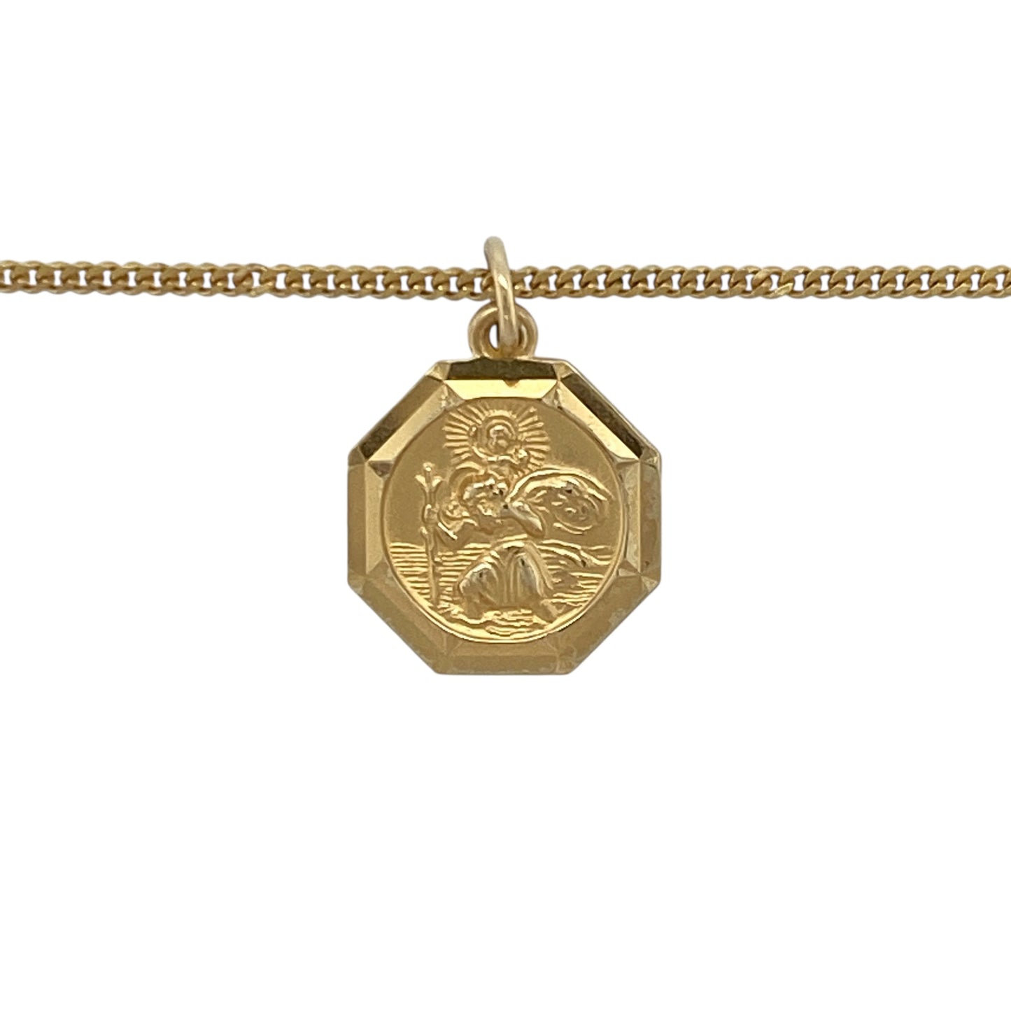 Bring classic faith and timeless style to your collection with this pre-owned 9ct yellow gold octagon-shaped St Christopher pendant on an 18" curb chain necklace, symbolising protection and safe travels—perfect for everyday wear or as a meaningful gift.
Design: The pendant features an octagon shape with a detailed depiction of St Christopher, measuring 1.9cm long including the bail, and is suspended from an 18" curb chain for a polished, elegant look.