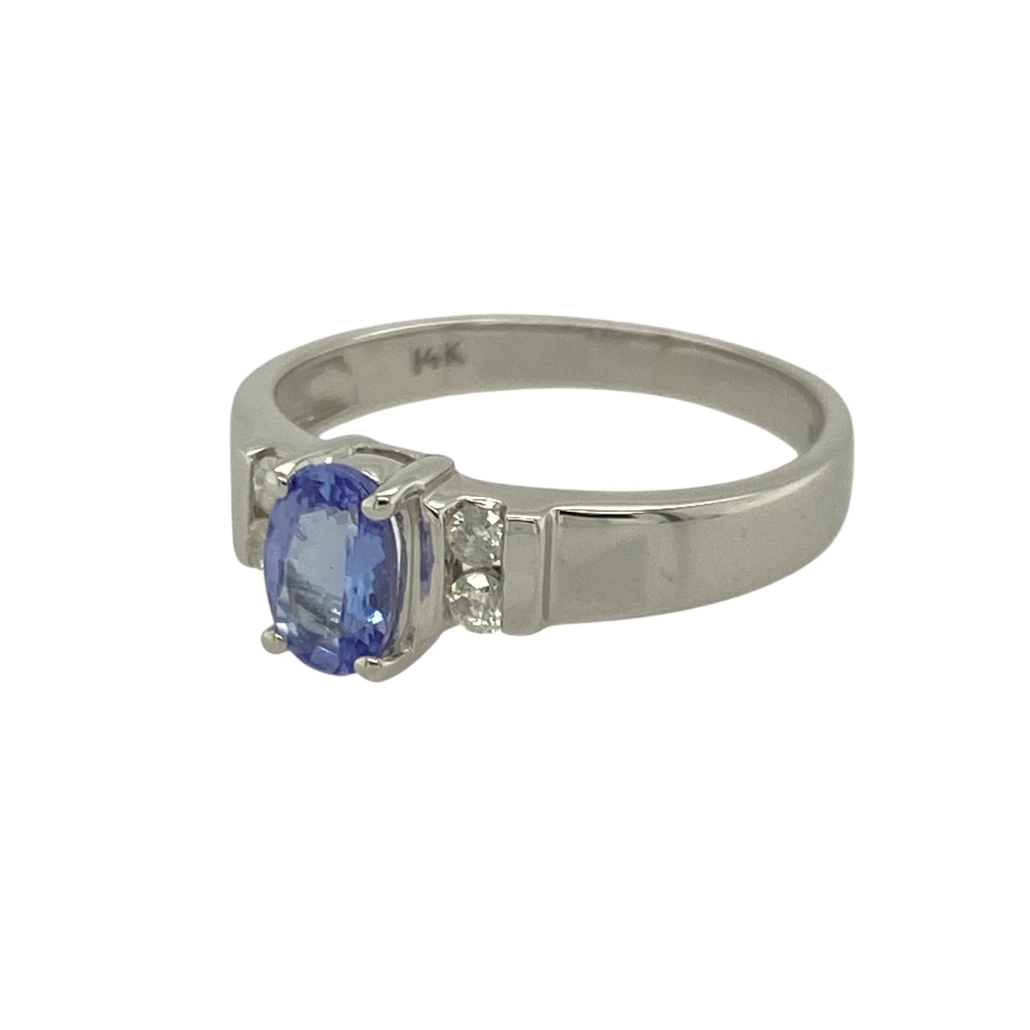 Bring elegant colour and refined sparkle to your collection with this pre-owned 14ct white gold diamond and tanzanite set ring—perfect for adding a touch of sophistication and luxury to any occasion.
Design: The ring features a captivating 6mm by 4mm oval-cut tanzanite at its centre, displaying the stone’s signature violet-blue hues. Two brilliant-cut diamonds are set on each side, enhancing the tanzanite’s colour and creating a graceful, balanced design.