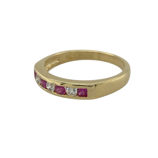 Add timeless beauty and refined colour to your collection with this pre-owned 18ct yellow gold diamond and ruby set band ring β a classic design that radiates warmth, elegance, and sophistication.
Design: The ring features a row of alternating round-cut 2mm rubies and sparkling diamonds across the 4mm wide front of the band, creating a balanced and graceful display of colour and brilliance.