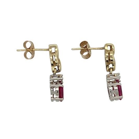 Add timeless beauty and refined colour to your collection with these pre-owned 9ct yellow gold diamond and ruby set drop earrings — an elegant design that radiates sophistication and charm.
Design: Each earring features a 6mm by 4mm oval-cut ruby suspended beneath a sparkling diamond, creating a graceful drop style that catches the light and enhances the natural brilliance of the gemstones.