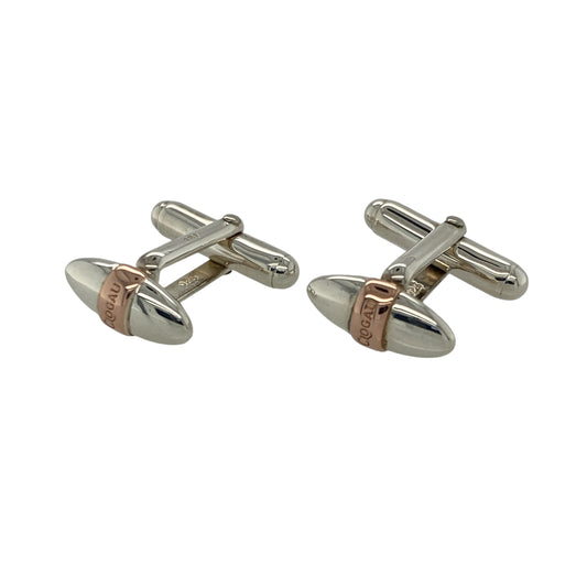 Bring sporting heritage and refined style to your collection with these pre-owned 925 silver with 9ct rose gold Clogau rugby ball cufflinks—a distinctive design celebrating Welsh pride and craftsmanship.
Design: Each cufflink is shaped as a detailed rugby ball, symbolising strength, teamwork, and national spirit, with a polished finish that adds a touch of sophistication.