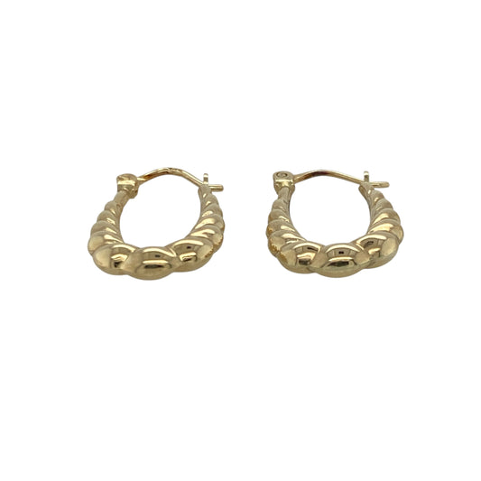 Bring playful texture and warm golden tone to your collection with these pre-owned 9ct yellow gold bubble-style creole earrings—an elegant pair offering subtle detail and timeless appeal.
Design: These oval creole earrings feature a raised bubble-style pattern, creating a soft, rounded texture that adds charm and visual interest to their classic shape.
Material: Made from 9-carat yellow gold, the earrings display a polished, radiant finish that enhances their warm golden glow.