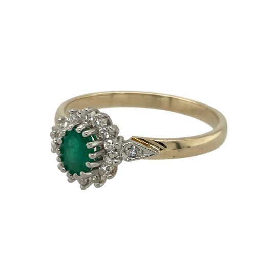 Bring vibrant colour and classic sparkle to your collection with this pre-owned 9ct yellow gold diamond and emerald cluster ring—an elegant piece offering timeless beauty and refined charm.
Design: This size O ring features a 5mm by 3mm oval emerald at the centre, surrounded by shimmering diamonds that create a traditional cluster effect, enhancing the stone’s rich green hue.