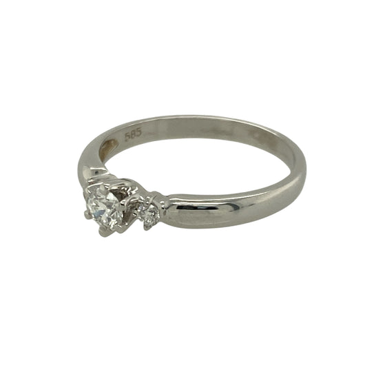 Bring timeless elegance and refined sparkle to your collection with this pre-owned 14ct white gold diamond trilogy ring—an exquisite piece offering classic beauty and symbolic meaning.
Design: This size M ring features a trilogy arrangement with a 0.21ct centre diamond framed by a diamond on each side, creating a balanced and graceful look that represents past, present, and future.