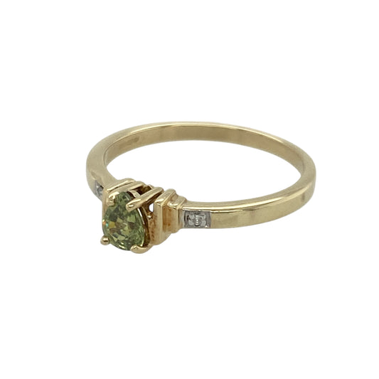 Bring fresh colour and delicate sparkle to your collection with this pre-owned 9ct yellow gold peridot and diamond ring—an elegant piece offering timeless charm and refined detail.
Design: This size N ring features a 5mm by 4mm teardrop-shaped peridot at the centre, enhanced by diamonds that add a touch of brilliance and balance to the vibrant green gemstone.
Material: Made from 9-carat yellow gold, the polished finish provides a warm, classic glow that complements the peridot’s lively colour.