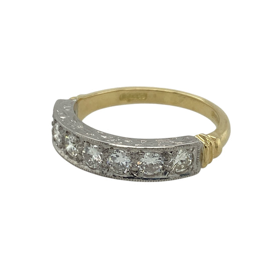 Bring exceptional brilliance and timeless elegance to your collection with this pre-owned 18ct yellow and white gold seven-stone diamond band ring—an exquisite piece offering luxurious sparkle and refined style.
Design: This size M band features a 6mm wide front set with seven brilliant-cut diamonds, each approximately 0.11ct, creating a beautifully balanced row of bright, continuous sparkle.