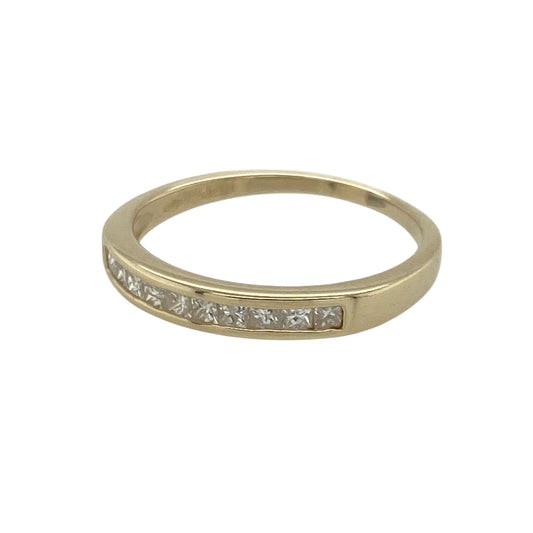 Bring refined sparkle and classic elegance to your collection with this pre-owned 9ct yellow gold diamond band ring—an attractive piece offering timeless style and subtle brilliance.
Design: This size L–M band features a 3mm wide front with ten princess-cut diamonds set neatly inside the band, creating a sleek, modern line of sparkle.
Material: Made from 9-carat yellow gold, the polished finish enhances its warm tone and highlights the clean geometric edges of the princess-cut stones.