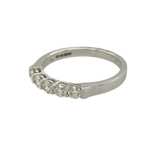 Bring classic brilliance and refined sophistication to your jewellery collection with this new 18ct white gold five-stone diamond band ring — a timeless design with impressive sparkle.
Design: The ring features five brilliant-cut diamonds arranged across the band, offering a balanced, radiant display of light and elegant symmetry.
Material: Made from 18ct white gold, the polished finish enhances the cool, luxurious tone of the metal and beautifully complements the diamonds’ bright fire.