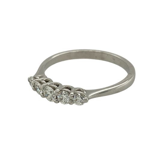 Bring elegant sparkle and timeless style to your jewellery collection with this new 18ct white gold five-stone diamond band ring — a refined piece with classic brilliance.
Design: The ring features five brilliant-cut diamonds arranged across the band, offering a balanced, radiant display with eye-catching symmetry.
Material: Made from 18ct white gold, the polished finish enhances the cool, luxurious tone of the metal and beautifully complements the diamonds’ bright sparkle.