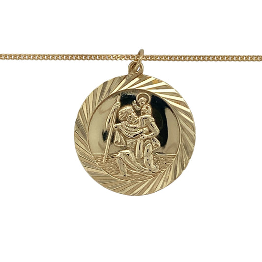 Bring meaningful symbolism and classic golden style to your collection with this pre-owned 9ct yellow gold large round St Christopher pendant necklaceβan enduring piece traditionally worn for protection and safe travel.
Design: The necklace features a detailed round St Christopher pendant, measuring 3cm in length including the bail. The intricately engraved design offers strong visual presence while maintaining a polished, timeless look.