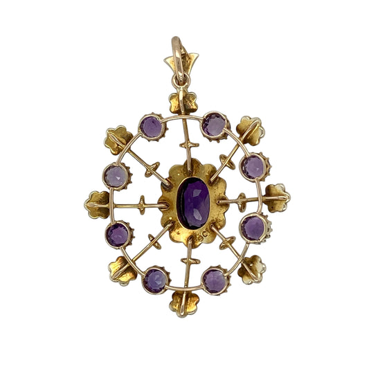 Bring vintage elegance and delicate colour to your jewellery collection with this pre-owned 9ct yellow gold amethyst & seed pearl set pendant, showcasing beautiful period-inspired detailing.
Design: The pendant features a vintage-style floral arrangement, with an oval amethyst at the centre, surrounded by seed pearls and an outer layer of round amethyst stones and seed pearls arranged in flower motifs.