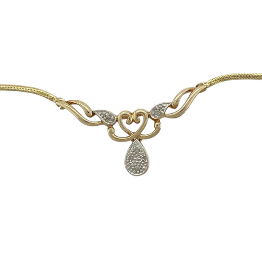 Bring romantic elegance and subtle sparkle to your jewellery collection with this pre-owned 9ct yellow and white gold & diamond set heart drop necklace, offering timeless charm with a refined finish.
Design: The necklace features a delicate heart-shaped drop pendant, accented with diamond detail for gentle sparkle, suspended from a sleek flat snake chain for a modern and elegant look.