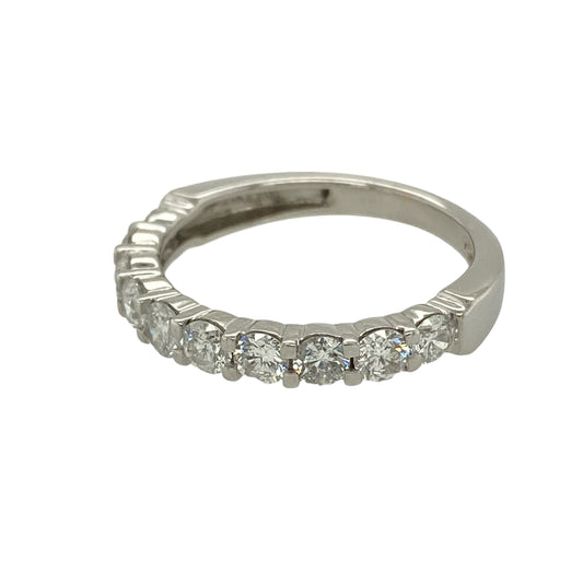 Bring exceptional sparkle and refined luxury to your jewellery collection with this pre-owned 18ct white gold diamond set band ring, a timeless design showcasing impressive diamond brilliance and classic elegance.
Design: The ring features a sleek band front set with ten brilliant-cut diamonds, evenly spaced to create a continuous line of sparkle across the finger.