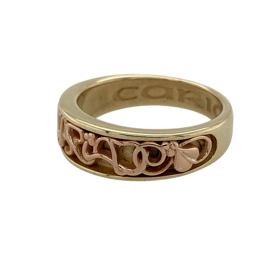 Bring heartfelt meaning and elegant design to your collection with this pre-owned 9ct yellow and rose gold Clogau Cariad band ring, symbolising love and affectionβperfect for marking special moments with timeless Welsh heritage.
Design: The front of the band measures 7mm wide and features the word Cariad (Welsh for "beloved") engraved in a flowing script, framed by softly polished edges and subtle rose gold detailing for a warm, meaningful contrast.