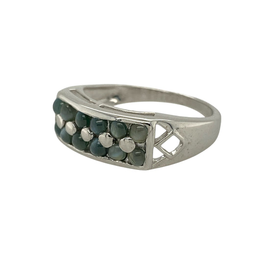 Bring captivating colour play and distinctive design to your jewellery collection with this pre-owned 9ct white gold two-row alexandrite cat’s eye set band ring, a striking piece with unique character.
Design: This ring features two rows of alexandrite cat’s eye stones across the band, displaying an enchanting light-reflective effect, with open-patterned shoulders that add decorative detail and visual depth.