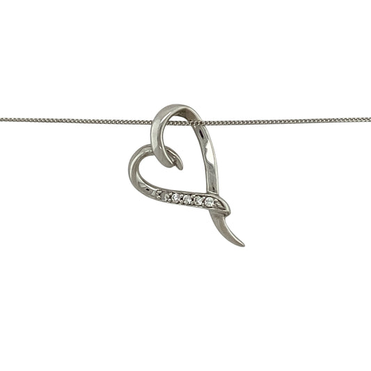 Bring delicate sparkle and romantic elegance to your jewellery collection with this pre-owned 9ct white gold diamond set open heart pendant necklace.
Design: The pendant features an open heart outline accented with shimmering diamonds, measuring approximately 2cm in length to create a graceful and eye-catching silhouette.
Material: Made from 9-carat white gold, the bright polished finish enhances the brilliance of the diamonds and gives the piece a clean, contemporary look.
