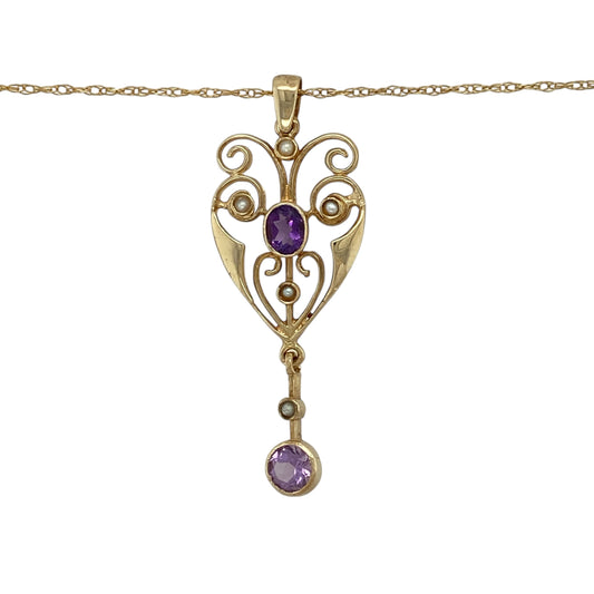 Bring vintage charm and elegant colour to your jewellery collection with this pre-owned 9ct yellow gold amethyst and pearl drop pendant necklace, combining classic gemstones with graceful movement—perfect for special occasions or refined everyday wear.
Design: The pendant features a vintage-inspired drop design, showcasing a rich purple amethyst accented by a pearl, creating a beautifully balanced and timeless look.