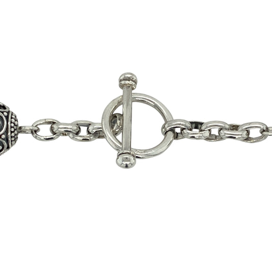 Make a bold and stylish statement with this pre-owned 925 silver patterned ball chain necklace—eye-catching, artistic, and full of contemporary character.
Design: This striking 18" necklace features large 15mm diameter ball links, each intricately patterned for texture and visual interest, creating a standout, sculptural look.
Material: Crafted from 925 sterling silver, the polished and patterned finish delivers contrast, depth, and a bold silver shine.