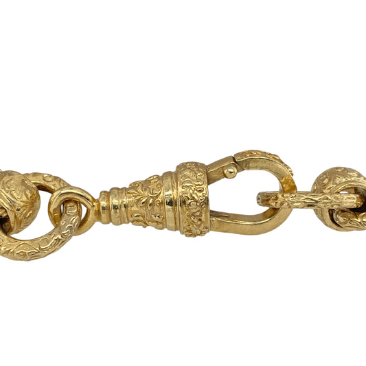 Make an impact with this new solid 925 silver rollerball bracelet, heavily plated in 9ct gold and designed with bold patterned links—perfect for statement wear and special occasions.
Design: The bracelet features large rollerball-style links with a patterned finish, each measuring 13mm in width for a strong and striking look.
Material: Made from solid 925 sterling silver with heavy 9-carat gold plating, the bracelet combines durability with a rich golden shine.