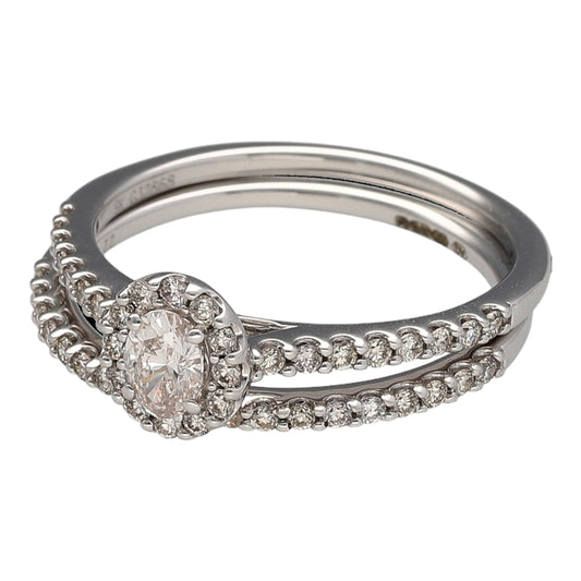 New 9ct White Gold & Diamond Oval Halo Solitaire Engagement Ring with diamond set shoulders with the 9ct White Gold & Diamond set Wedding Band Ring. These rings are in size N with the the collective weight 2.90 grams. Collectively the set contains approximately 0.69ct of diamond content in total. The wedding band contains approximately 19pt and the teardrop solitaire ring contains approximately 50pt. The diamonds are approximate clarity Si and colour J - K