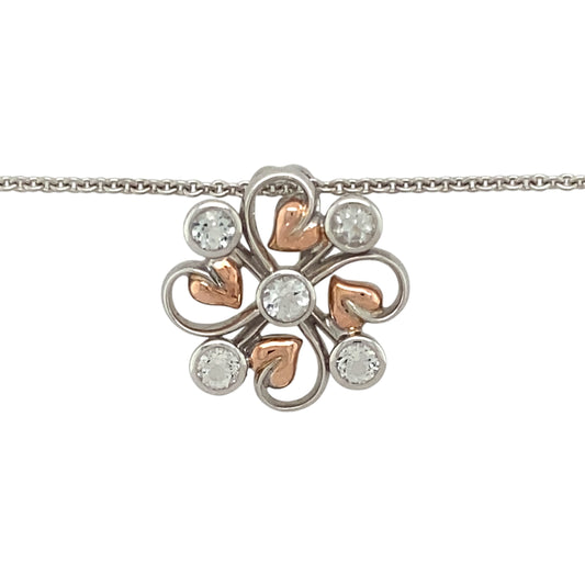 Preowned 925 Silver with 9ct Rose Gold Clogau & White Topaz Set Tree of Life Pendant on an 18" - 22" Clogau curb chain with the weight 7.80 grams. The pendant is 2.3cm diameter and the topaz stones are each approximately 3mm diameter