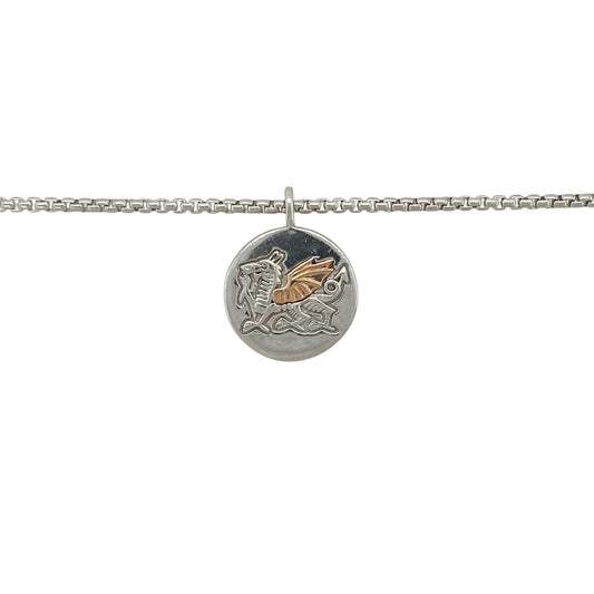 Bold in meaning and crafted with pride, this pre-owned Clogau necklace features the iconic WRU Welsh Dragon emblem—perfect for supporters, collectors, or as a symbol of national heritage.
Design: The necklace features a 2.1cm round pendant (including the bail) with the official Welsh Rugby Union (WRU) Welsh Dragon emblem in 925 silver, accented with 9ct rose gold for added warmth and depth.