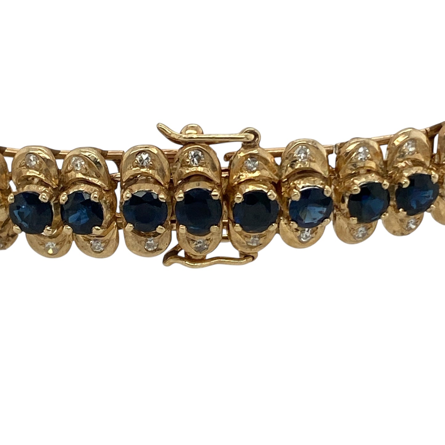 Bring vibrant colour and refined sparkle to your collection with this pre-owned 14ct yellow gold diamond and sapphire bracelet—a timeless design that combines classic gemstones with elegant craftsmanship.
Design: The bracelet features a continuous line of rich blue sapphires, each measuring approximately 3mm in diameter, with a sparkling diamond set above and below each gemstone. The alternating pattern creates a beautiful rhythm of colour and brilliance.