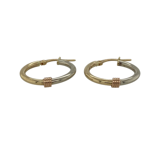 Bring classic versatility and subtle contrast to your jewellery collection with these pre-owned 9ct yellow, rose and white gold hoop creole earrings, offering a timeless two-tone design that suits any style—perfect for everyday wear.
Design: The earrings feature a traditional hoop creole shape with a combination of yellow and white gold, creating a clean and elegant two-tone look.