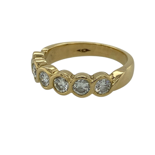 Bring flowing elegance and refined sparkle to your jewellery collection with this pre-owned 18ct yellow gold diamond wave rubover set six stone band ring, offering a timeless design with graceful movement—perfect for everyday wear or special occasions.
Design: The ring features six diamonds rubover set in a gentle wave formation, creating a smooth, flowing profile with elegant visual balance.