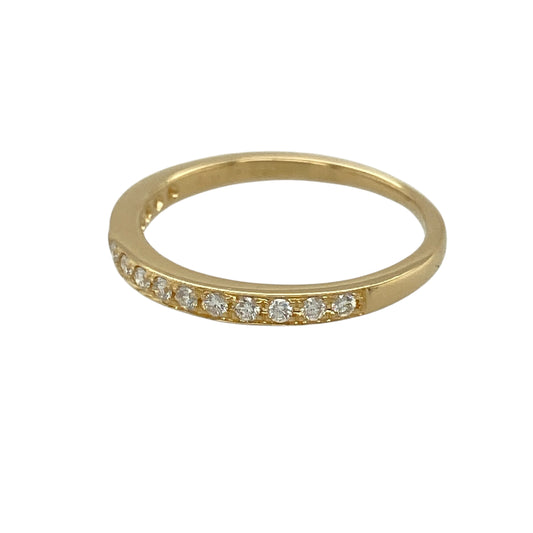 Add understated elegance and refined sparkle to your jewellery collection with this pre-owned 18ct yellow gold and diamond set band ring, offering a delicate design with timeless appeal—perfect for everyday wear or stacking.
Design: The ring features a slim band with a front width of approximately 2mm, set with diamonds that provide subtle brilliance without overpowering the minimalist style.