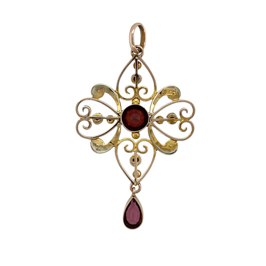 Add romantic vintage charm and delicate colour to your jewellery collection with this pre-owned 9ct yellow gold Edwardian style pendant, featuring seed pearls, pink tourmaline, and garnetβperfect for lovers of antique-inspired jewellery.
Design: The pendant showcases a classic Edwardian-inspired design with a central round garnet measuring approximately 5mm in diameter, surrounded by delicate seed pearls, and finished with a teardrop pink tourmaline