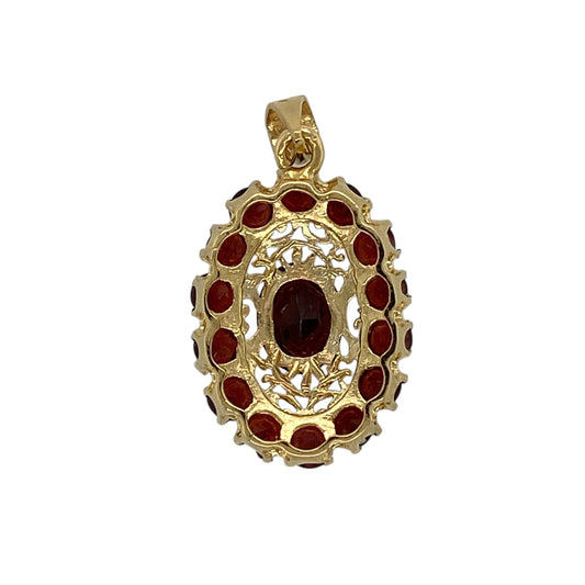 Add rich colour and timeless elegance to your jewellery collection with this pre-owned 18ct yellow gold and garnet set oval cluster pendant, offering classic design with refined presence—perfect for special occasions or everyday wear.
Design: The pendant features an oval cluster arrangement with a central garnet measuring approximately 9mm by 7mm, forming a striking and elegant focal point.